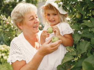 Grandmother and granddaughter enjoyed in the garden