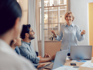 Team of business investors is discussing a new project in modern office. Concept of financing